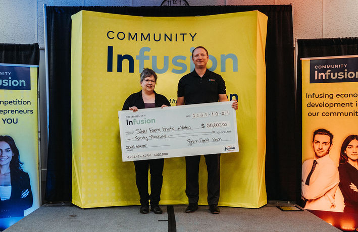 Fusion CEO Presents Cheque To Community Infusion 2025 Winner 555X360
